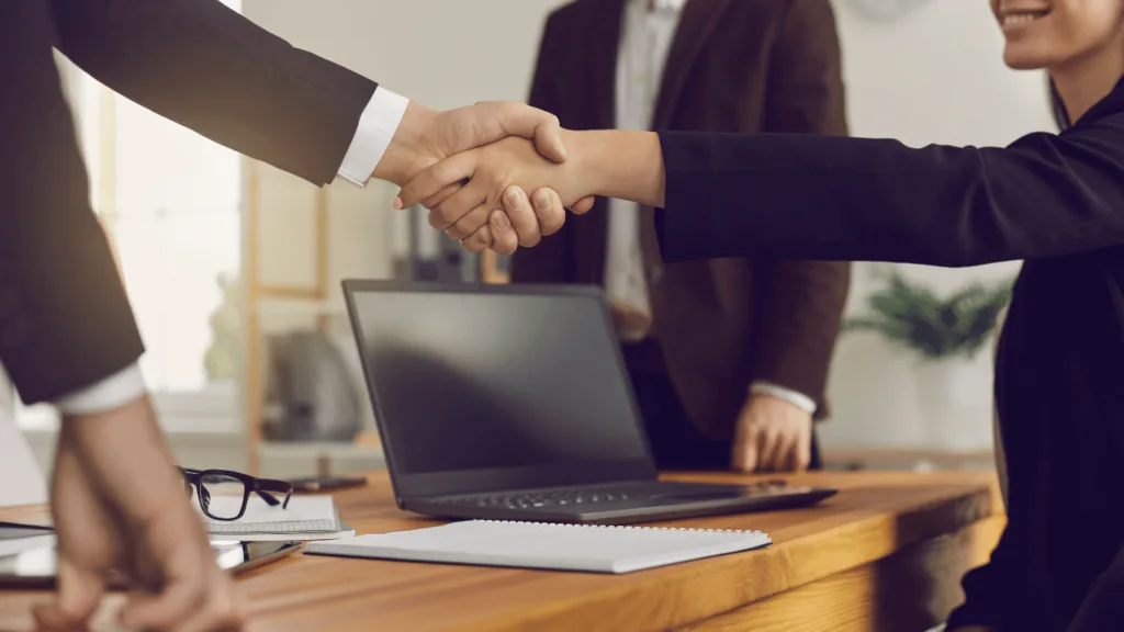 Business owner making agreements with an outsourced customer service partner