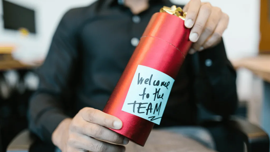 Remote employee receiving a welcome package from the virtual team as part of the remote onboarding process