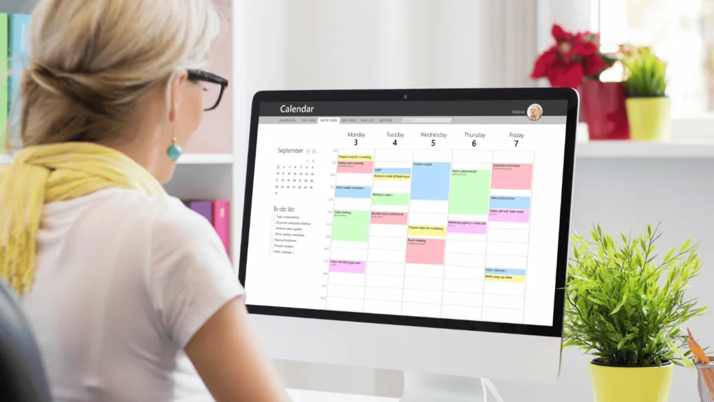 Remote work calendar on screen being checked out by remote workers