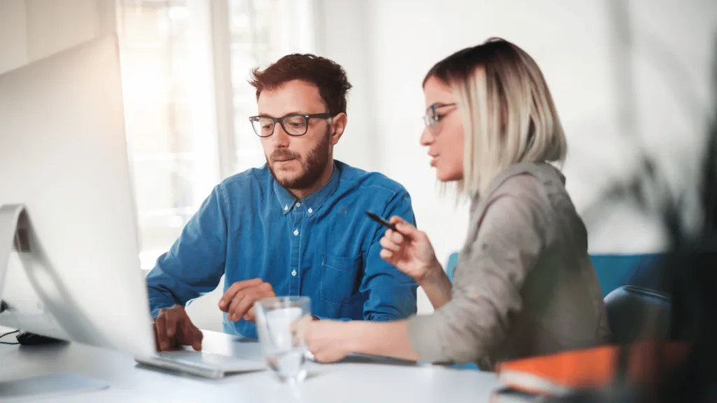 Business owner reaching out to an outsourced support team to improve live chat performance